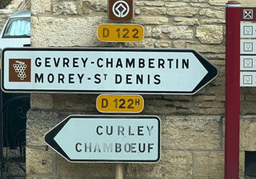 Road signs showing directions to Gevrey-Chambertin, Morey-St Denis, and Curley Chamboeuf on D122 and D122H routes.