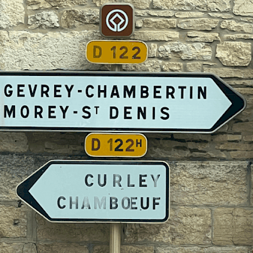 Road signs showing directions to Gevrey-Chambertin, Morey-St Denis, and Curley Chamboeuf on D122 and D122H routes.