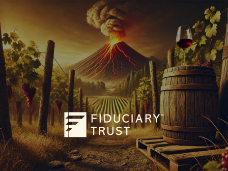 A vineyard with grapes, a wine barrel, and a glass of wine in front of a volcano. "FIDUCIARY TRUST" text and logo are present.